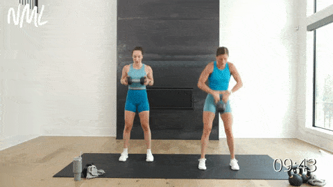 two women performing a deadlift and kettlebell clean and front squat and overhead shoulder press in a kettlebell workout
