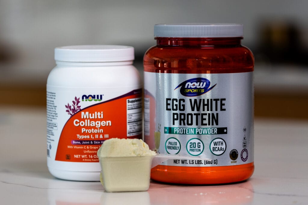 image of protein powder and collage powder on counter top as example of best protein powder for women