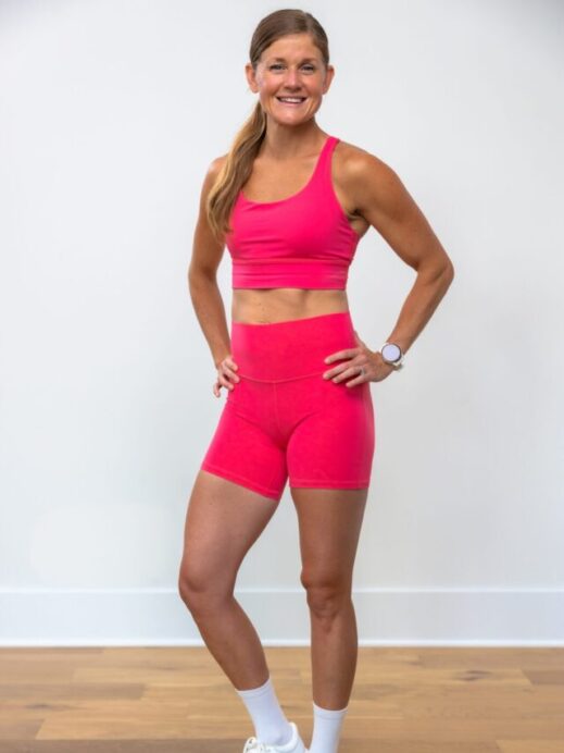 woman posing in pink lululemon sports bra to show energy bra review
