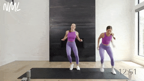 two women performing double side to side taps as example of best cardio to lose weight