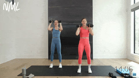 two women performing narrow dumbbell shoulder presses as example of best shoulder exercises for women