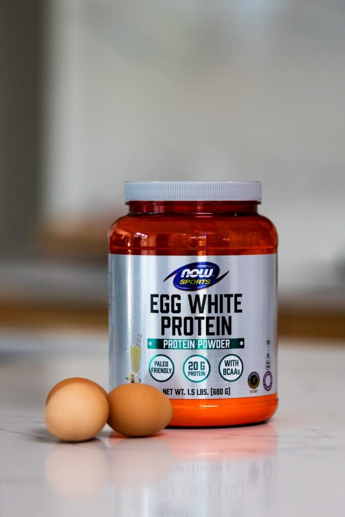 Image of egg white protein powder on countertop as part of best supplements for women review post