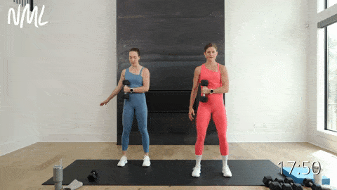 two women performing external rotations with dumbbells - dumbbell shoulder workout for women