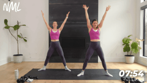 standing women performing yoga sculpt horse pose