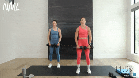two women performing upright row and lateral raise combo dumbbell shoulder exercise