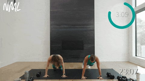 two women performing push ups in a full body dumbbell AMRAP workout