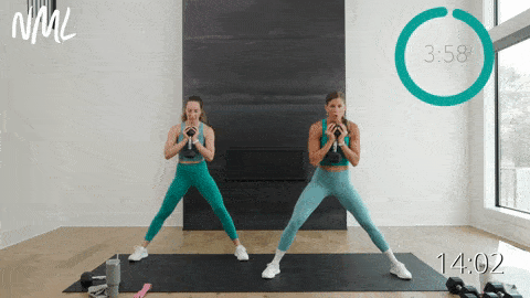 two women performing lateral squats in an AMRAP workout