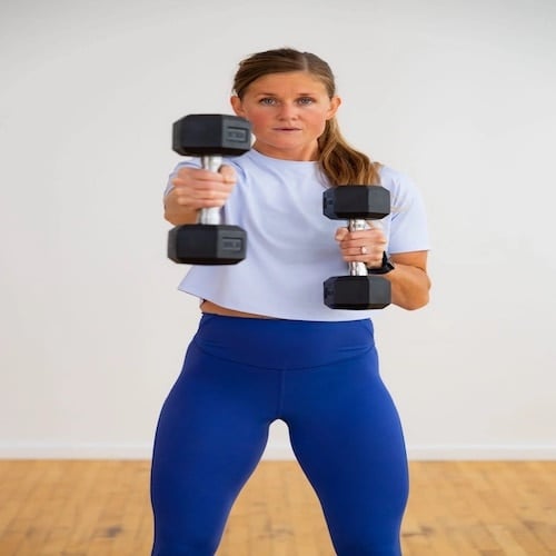 Woman performing a dumbbell punch