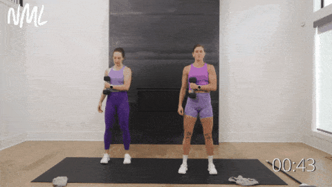 Two women performing external shoulder rotations as part of shoulder mobility workout