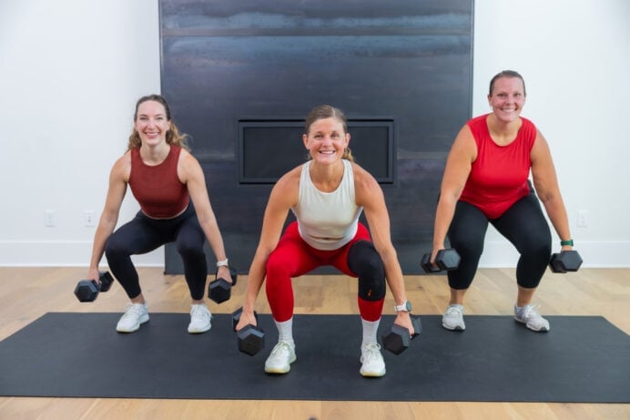 three women performing a squat with dumbbells as part of circuit workout