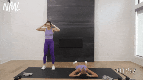 two women performing prone shoulder swimmers exercise