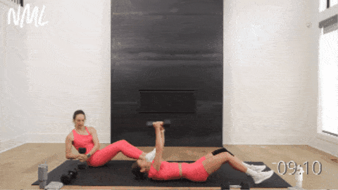 two women performing sit ups as part of 15 minute workouts