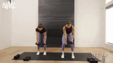 two women performing alternating back rows as part of beginner dumbbell workout