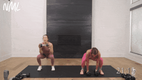 two women performing dumbbell burpees as example of best full body exercises with dumbbells