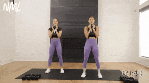 Two women performing goblet squats as part of beginner dumbbell workout
