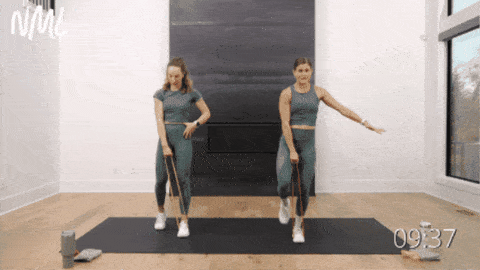 two women performing a single leg deadlift and row as example of exercise with resistance band