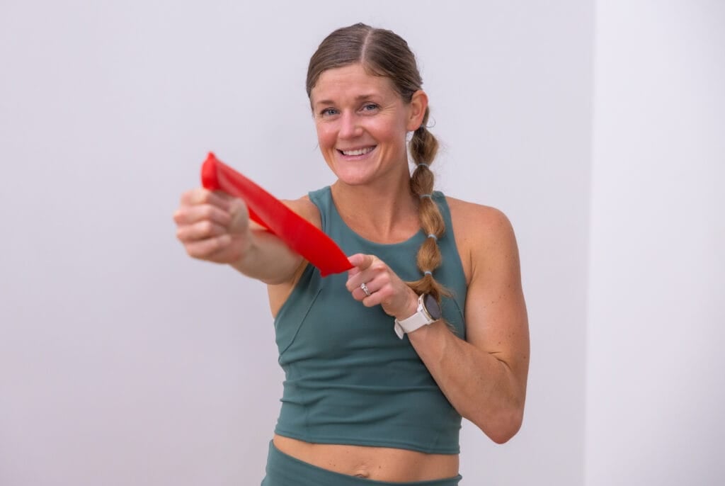 woman holding resistance band