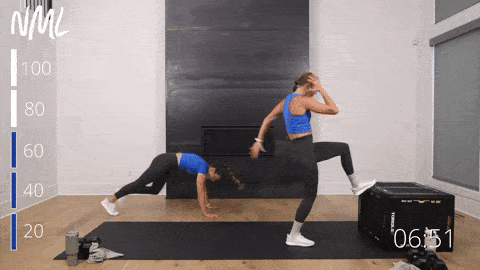 two women performing burpees in a core and cardio workout
