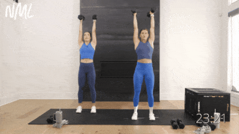 two women performing hammer curls and neutral shoulder presses as part of back row workout