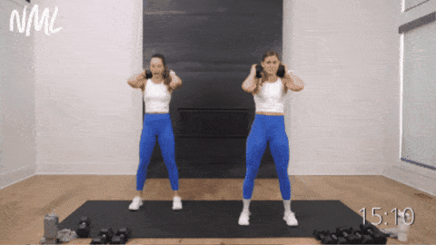 two women performing kang squats as example of dumbbell leg exercises