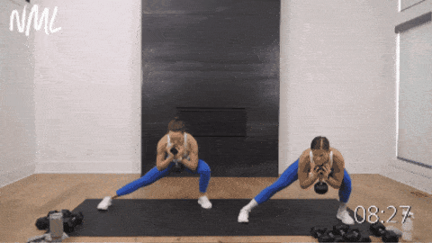 two women performing lateral lunges and reverse lunges