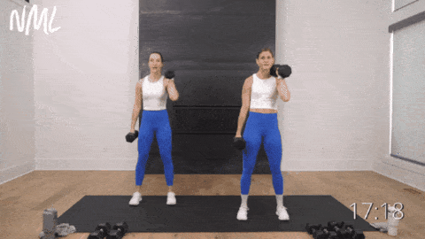 two women performing an uneven rack squat