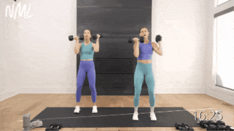 two women performing alternating arnold press to target the arms and shoulders