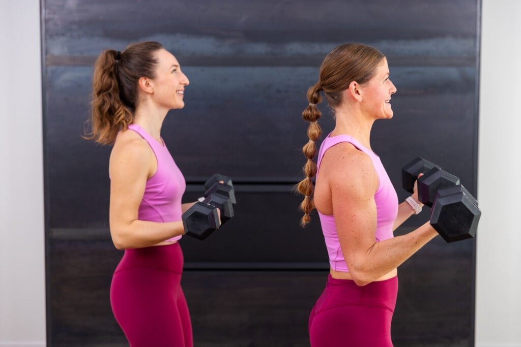 two women performing bicep curls as part of strength and walking workout