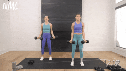 two women performing flip grip bicep curls as part of upper body dumbbell workout