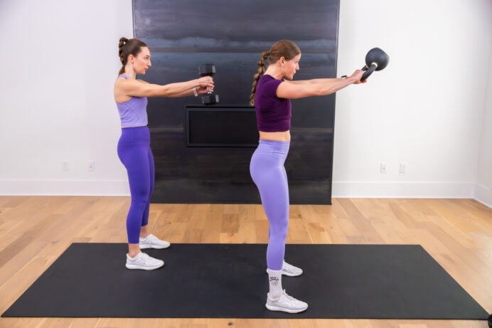 two women performing kettlebell swings as part of beginner kettlebell workout