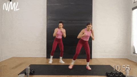 two women performing a lateral step and jab as part of walking workout