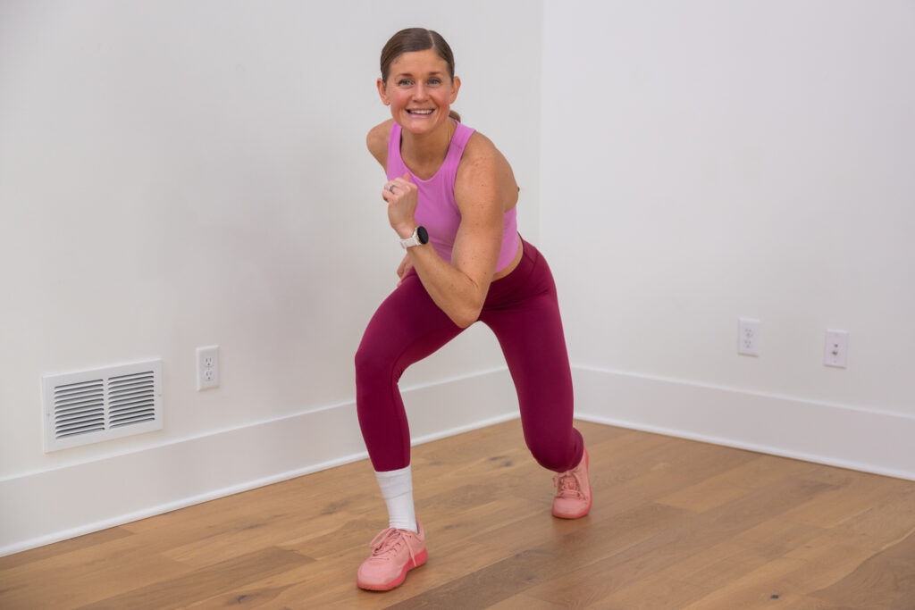 woman wearing garmin to track steps during walking workout