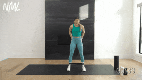woman performing banded squats as example of Exercises for SI Joint Pain 
