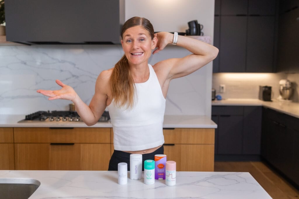 Women smelling armpit with the best aluminum-free deodorants including hume supernatural, Megababe, native and Primally Pure. 