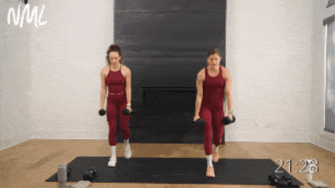 two women performing dumbbell reverse lunges with lat raises