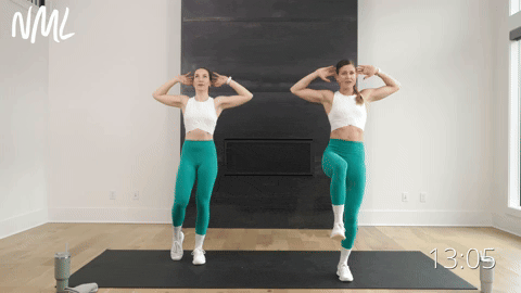 two women performing a bodyweight balance back fly in a beginner workout routine
