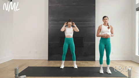 two women performing a lateral squat and cross body crunch in a workout routine for beginners