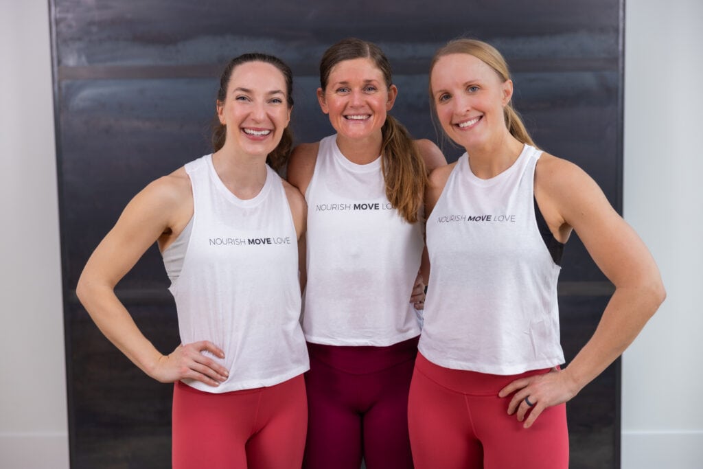 three women smiling after completing hiit workout for women