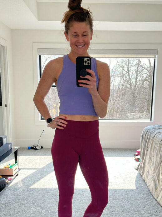 Woman wearing red lululemon wunder under leggings
