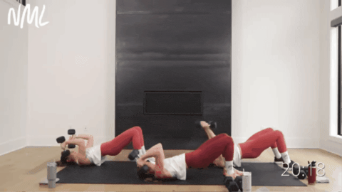 three women performing a skull crusher with a glute bridge hold as part of best strength and hiit workout for women