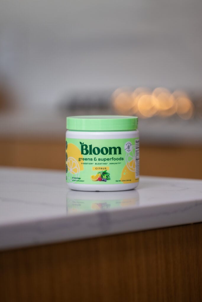 Bloom greens and super foods on the kitchen counter in citrus flavor. 