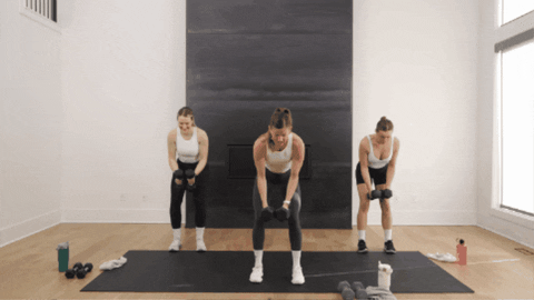 three women performing a back fly exercise as part of strong arms workout