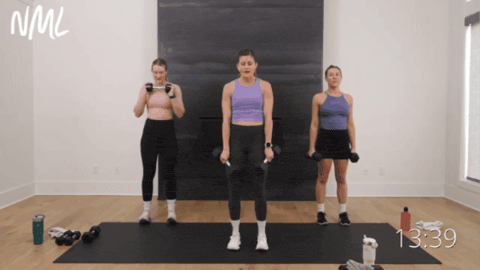 three women performing weighted calf raises as part of strong legs workout