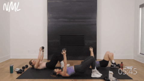 three women performing a glute bridge as part of strong legs workout