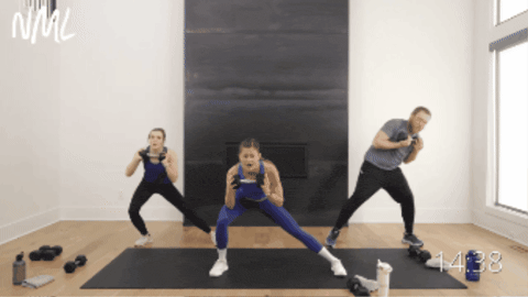 three people performing a lateral squat with a standing oblique crunch as part of total body workout