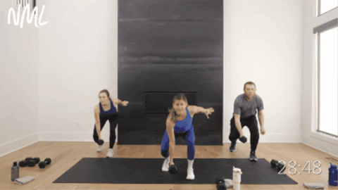 three people performing a staggered squat pulse as part of total body workout
