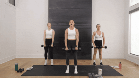three women performing upright rows as example of strong arms exercises