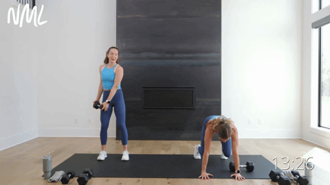 women performing a dumbbell drag from a beast position into a push up