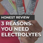 woman holding up three flavors of lmnt electrolytes