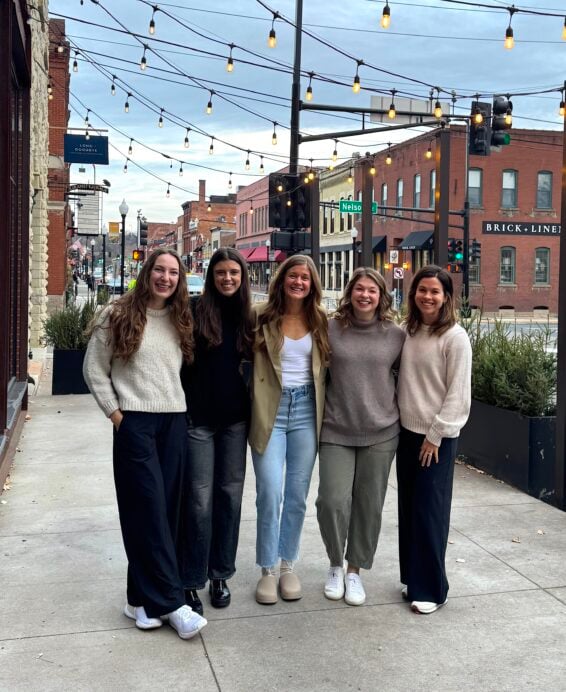 Nourish Move Love Team of five employees standing together outside